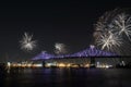 Colorful fireworks explode over bridge. MontrealÃ¢â¬â¢s 375th anniversary. luminous colorful interactive Jacques C Royalty Free Stock Photo